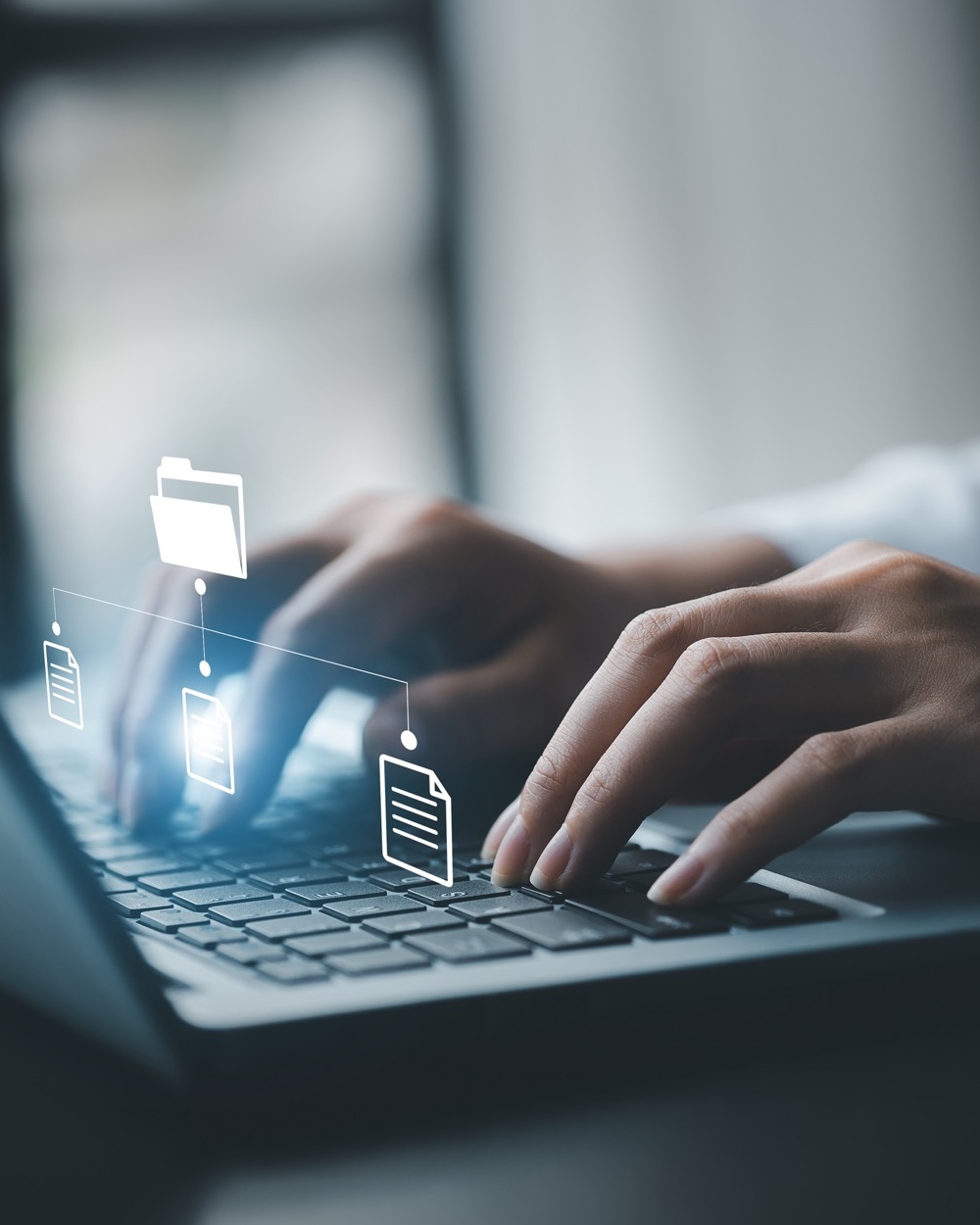 business man typing on a keyboard with holograms of digital document files, data files on computers stored as cloud databases can be viewed online and prevented data loss from the device. business man typing on a keyboard with holograms of digital document files, data files on computers stored as cloud databases can be viewed online and prevented data loss from the device.